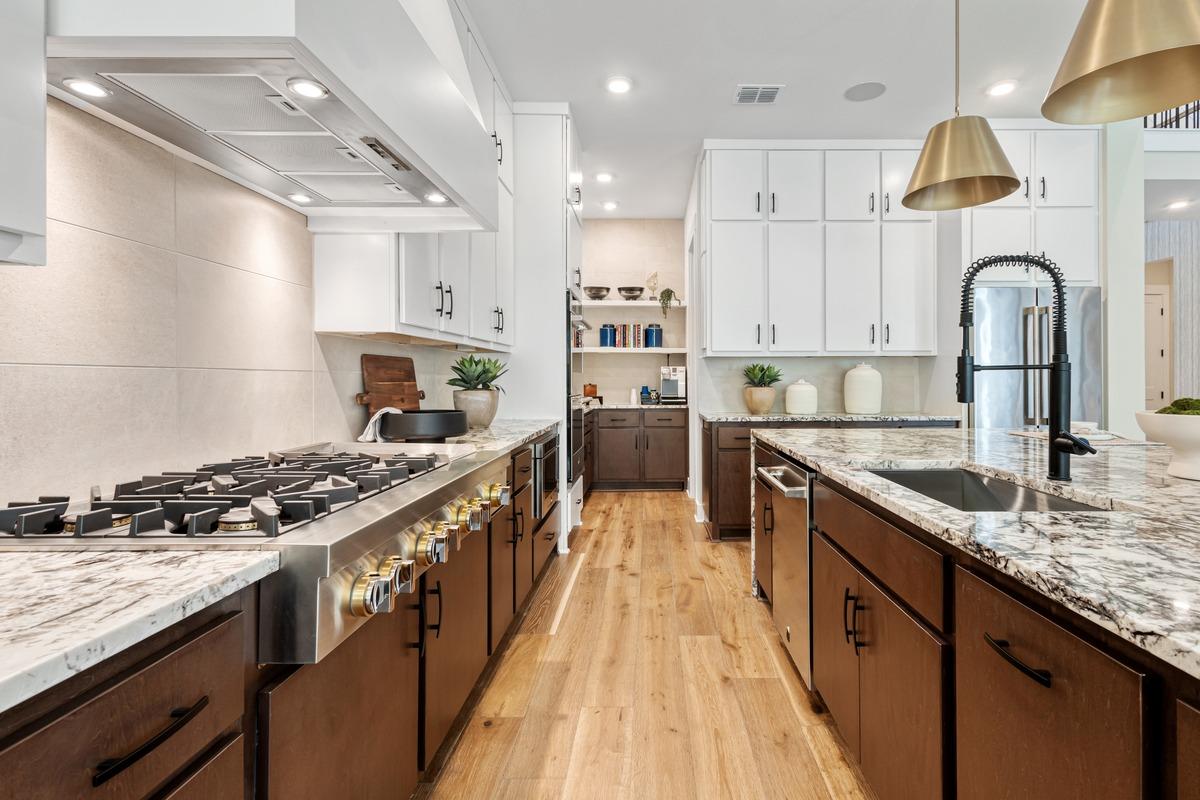 Contemporary kitchen featuring updated appliances and counters